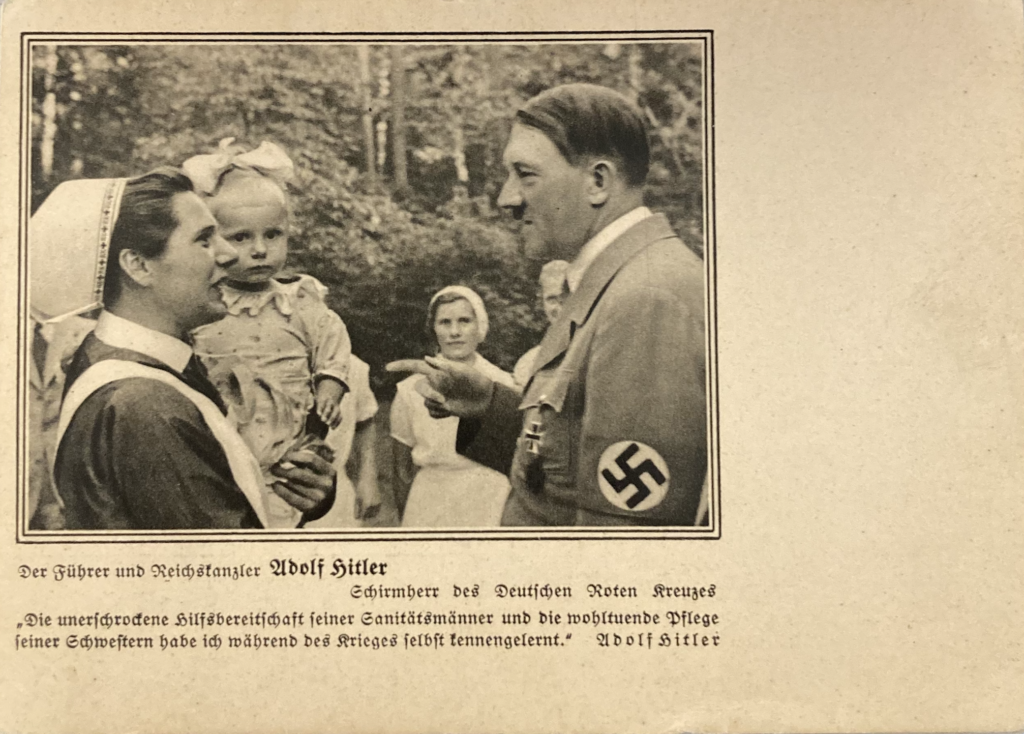 Hitler talking to a Red Cross nurse